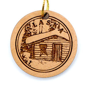 Cabin in the woods birch ornament. Size 2 x 2 x 3/16. Birch ornament made in Alaska.