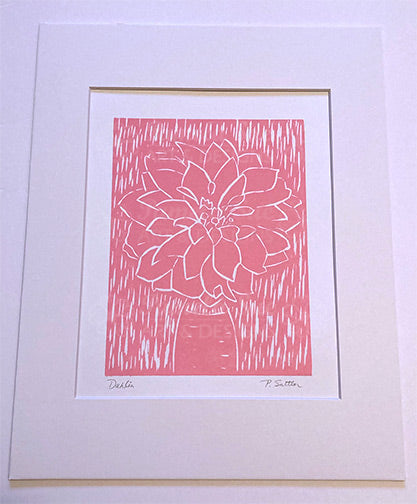Dahlia woodcut relief print shown with mat (not included). Relief prints are hand printed from a carved wood block by Alaskan artist, Pamela Sue. Enjoy this original piece of art. Available from PamelaSueArtandDesigns.com in Alaska.