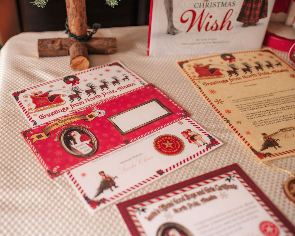 Sample of Ready to Personalize Letter from Santa, North Pole Envelope and Good Boys and Girls Certificate. Also includes a mini Northern Lights photo card with the view from Santa's home! Available from Pamela Sue Art & Designs in North Pole, Alaska.
